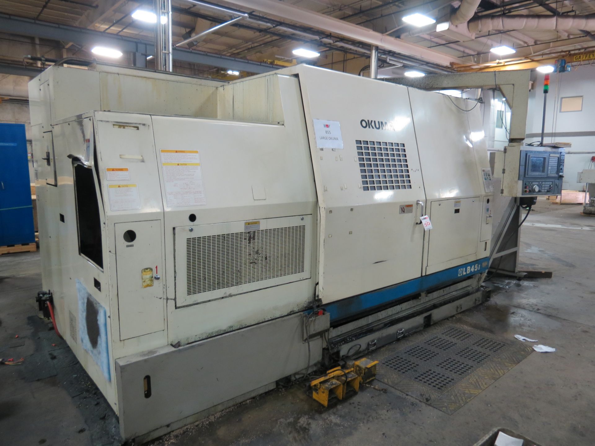 Okuma LB-45II CNC Hollow Spindle Turning Center, OSP 7000L control, 7" bore, 24" Dual chuck,