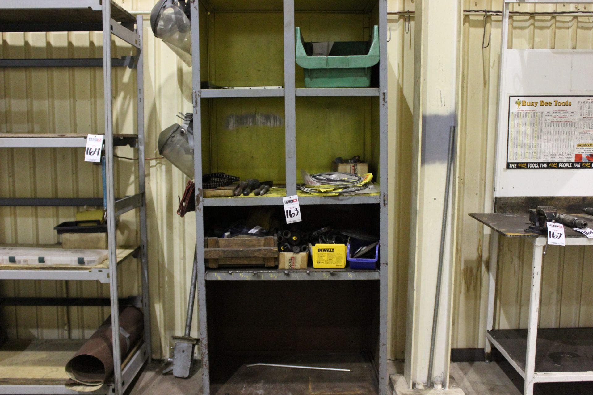 METAL SHELVING UNIT, ASSORTED GRINDER PARTS, DISCS, AND FACE SHIELDS
