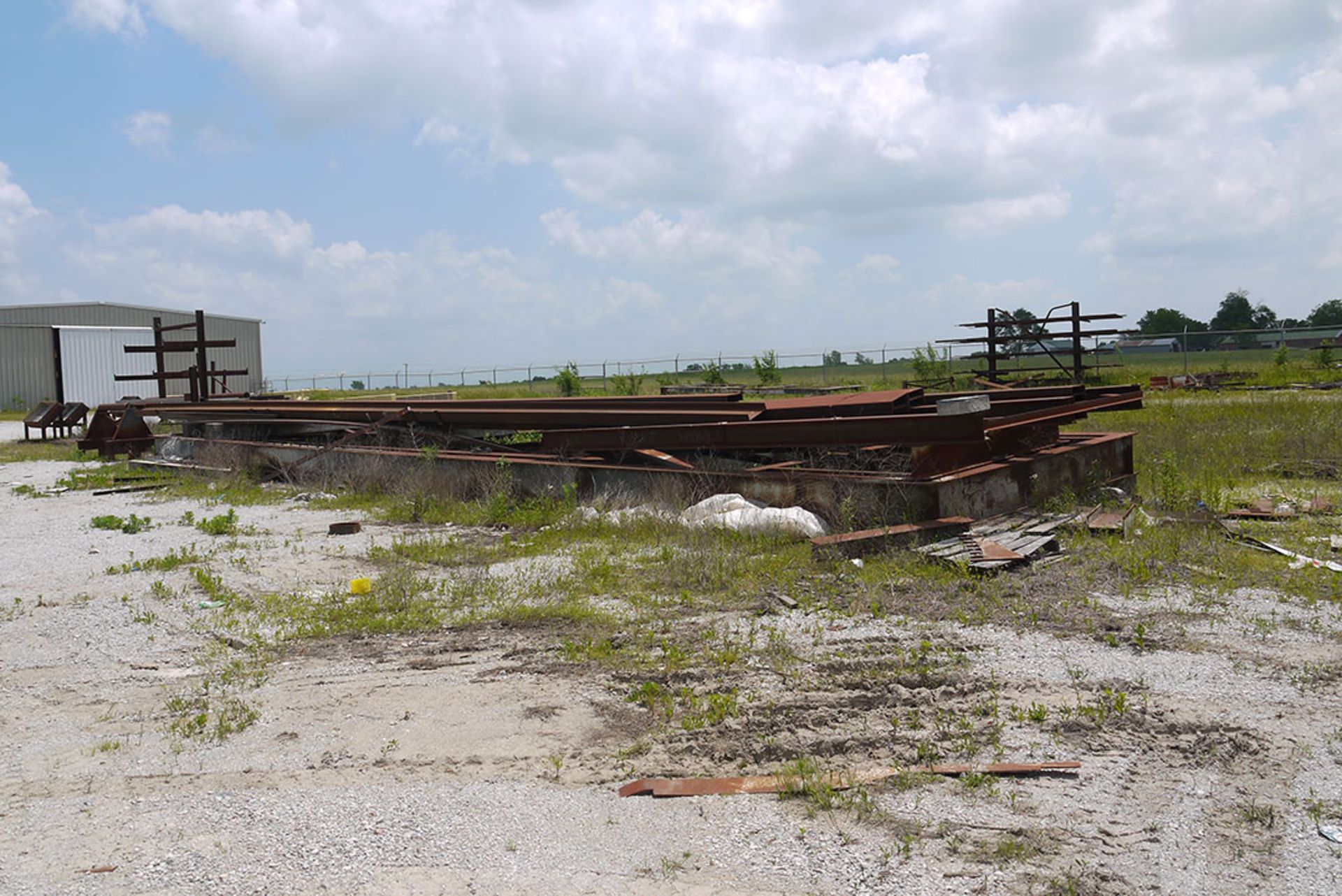 LARGE LOT OF STEEL STOCK; DOUBLE SIDED RACK WITH CONTENT, RAIL CAR WITH CONTENT