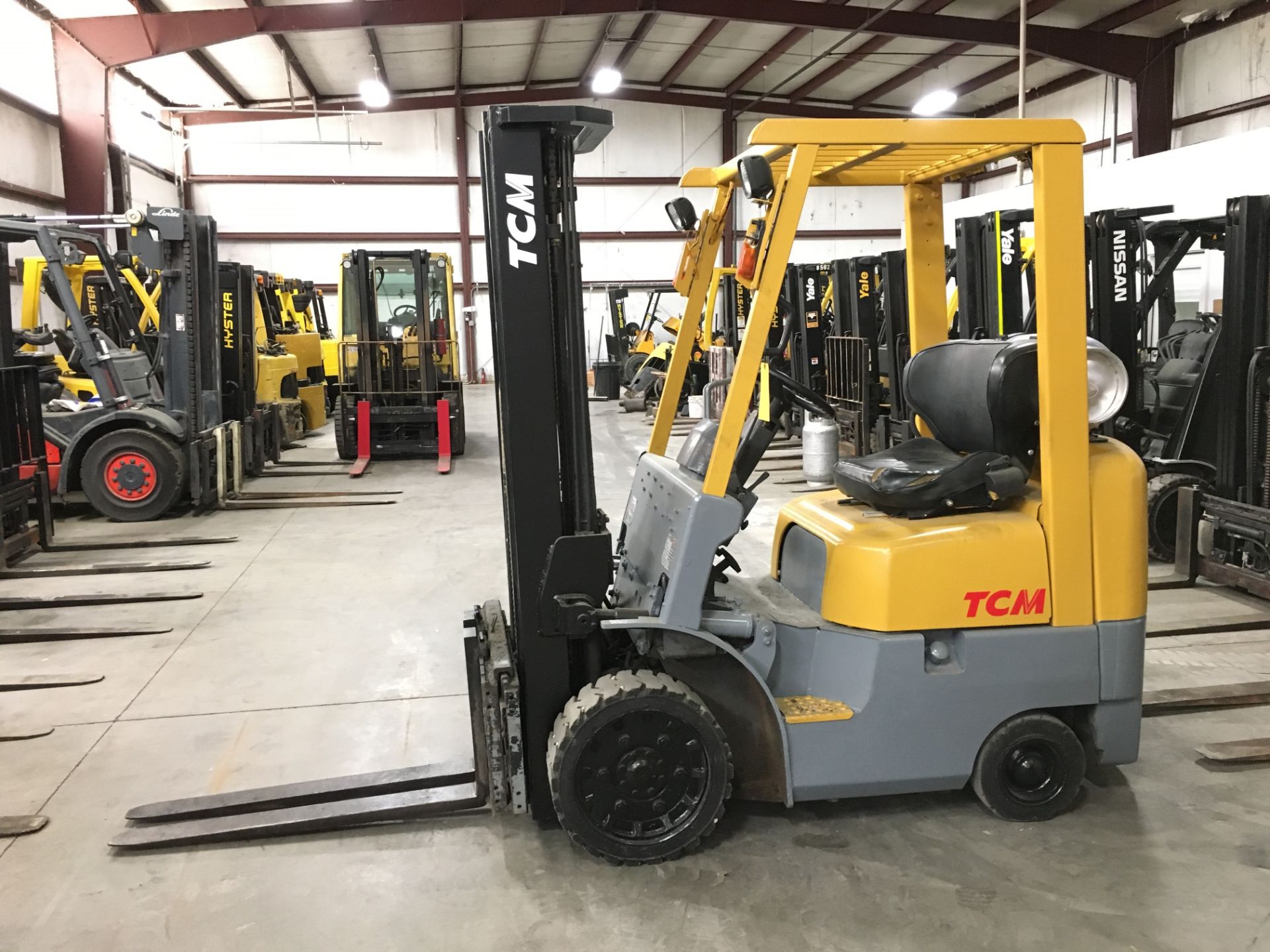 TCM 3,000-LB., MODEL: FCG15F9, S/N: A12R01063, LPG, LEVER SHIFT, SOLID TIRES, 3-STAGE MAST, 189'`