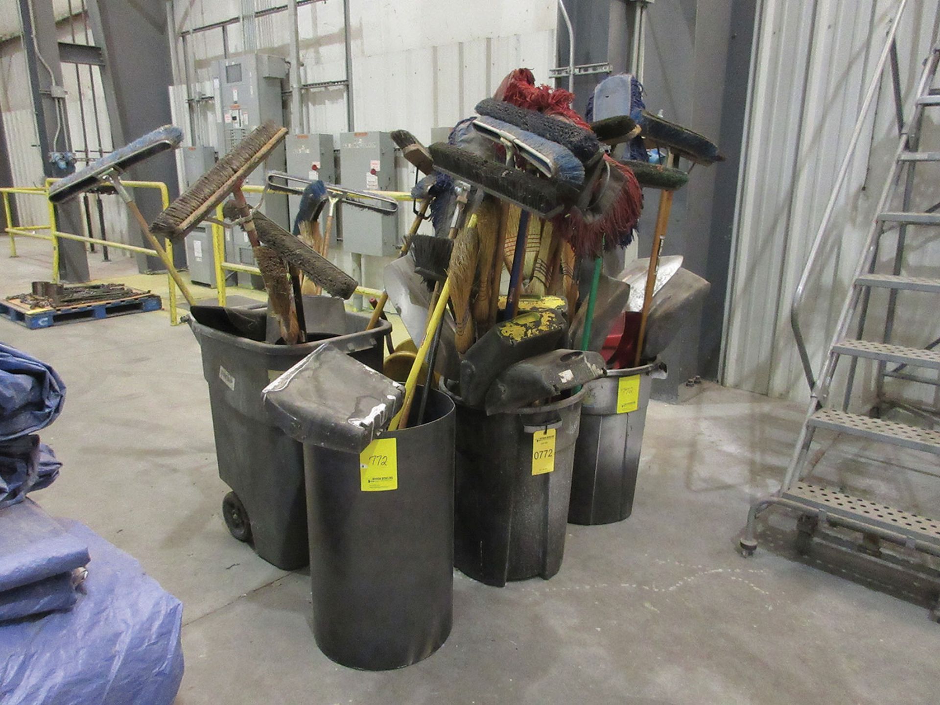 (3) TRASH CANS W/ BROOMS, SHOVELS, AND DUST PANS