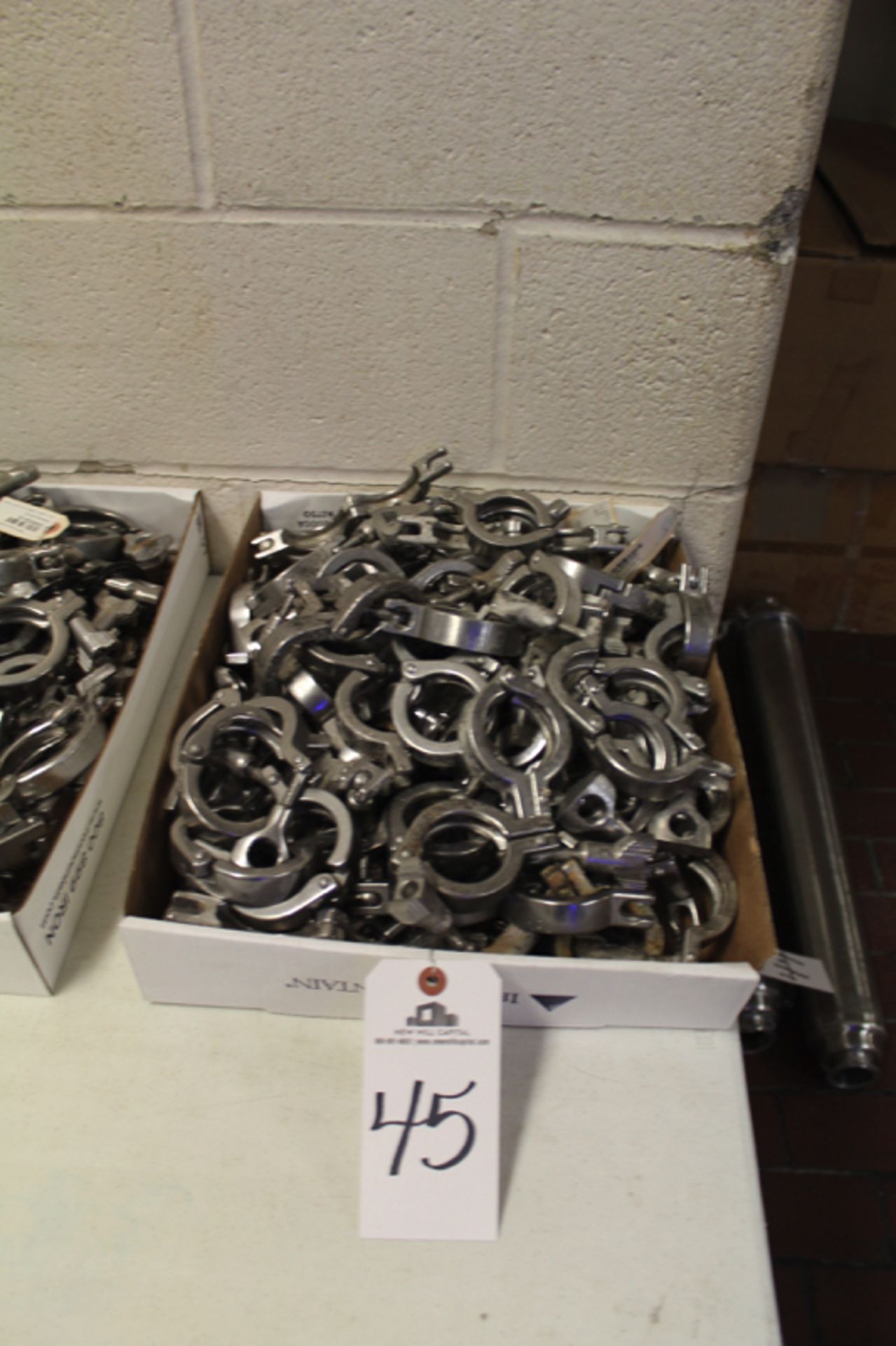 Lot of (82) Sanitary Pipe Clamps | Location: Oven/Mixing Room | Rigging Price: Buyer May Hand