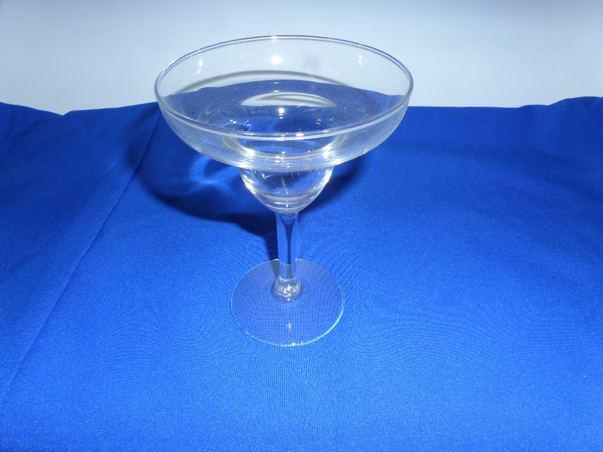 (144) Margarita Glasses in 9 Plastic Glass Racks