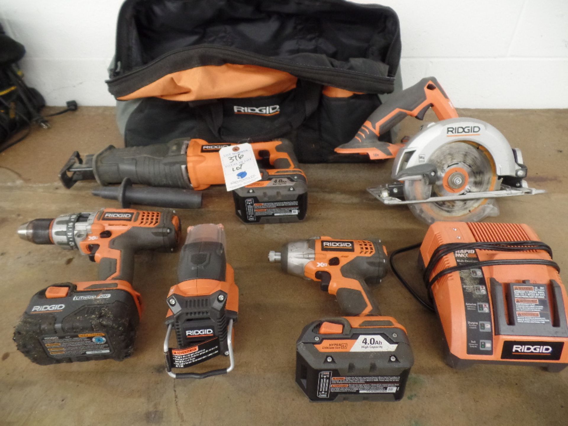 Rigid Cordless Tools (2) Saws (2) Drills (1) Light (3) Batteries (1) Charger (1) Bag