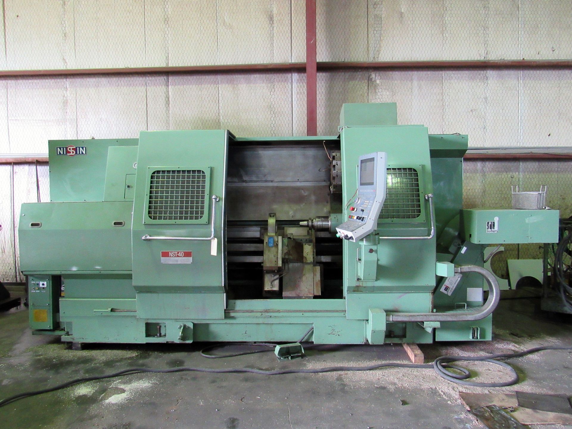 NISSIN MDL. NST-40/125 CNC LATHE, rewired & retrofitted in 2010, NCT CNC control, 26” sw. over