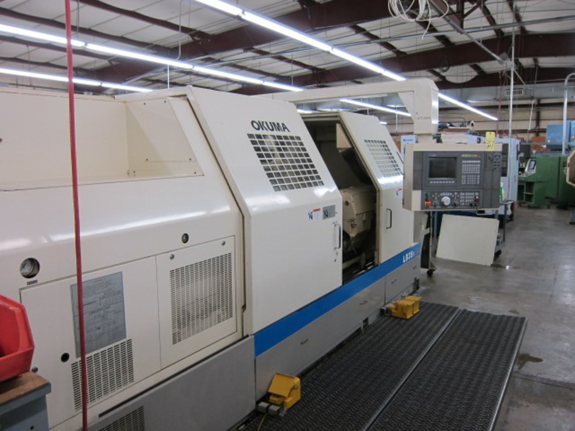 CNC SLANT BED LATHE, OKUMA MDL. LB35II, Okuma OSP7000L CNC control, 27.5” sw. over bed, 78” dist.