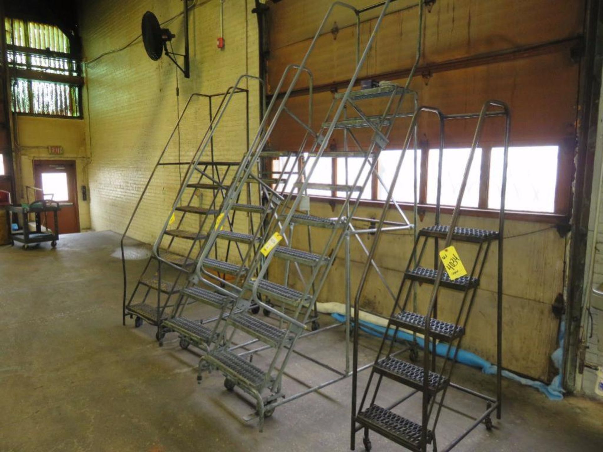 LOT: (1) 9-Step Rolling Safety Ladder, (2) 7-Step Rolling Safety Ladders, (1) 4-Step Rolling