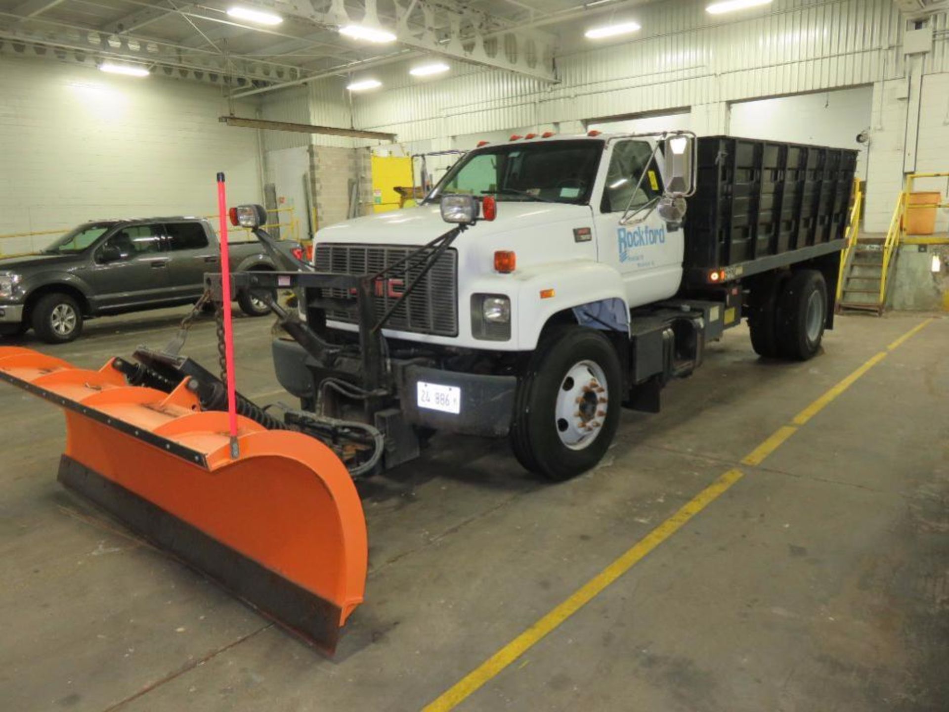 2002 GMC 14 ft. Single-Axle Stake/Dump Truck Model C7500, VIN 1GDL7H1E62J504353 (in loading dock) (