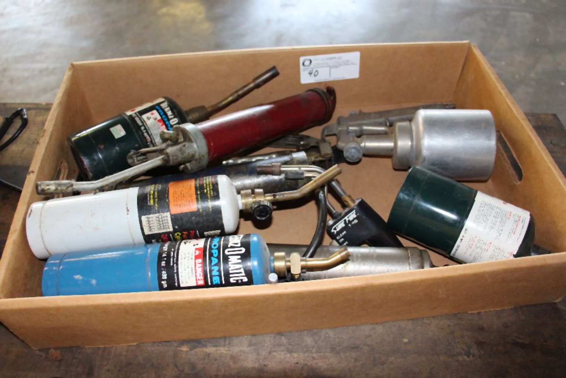 Assortment of grease guns and propane torches