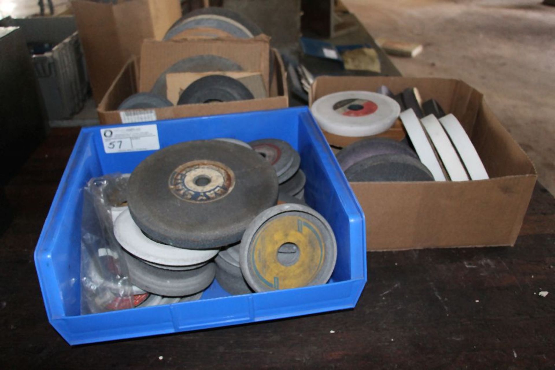 large assortment of grinding wheels