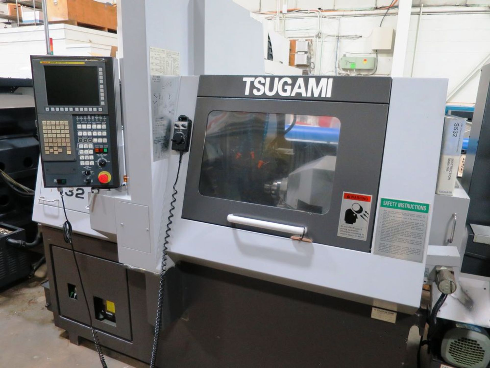 32MM TSumai SS32 Super Swissturn Sliding Headstock CNC Automatic Lathe, S/N 183 Working barstock