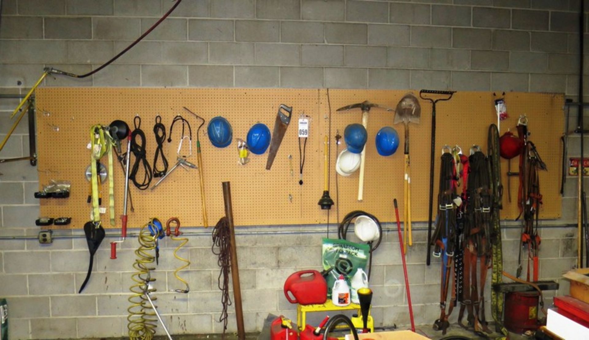 Wall Rack of Misc Tools Including Straps, Hand Tools, Etc.