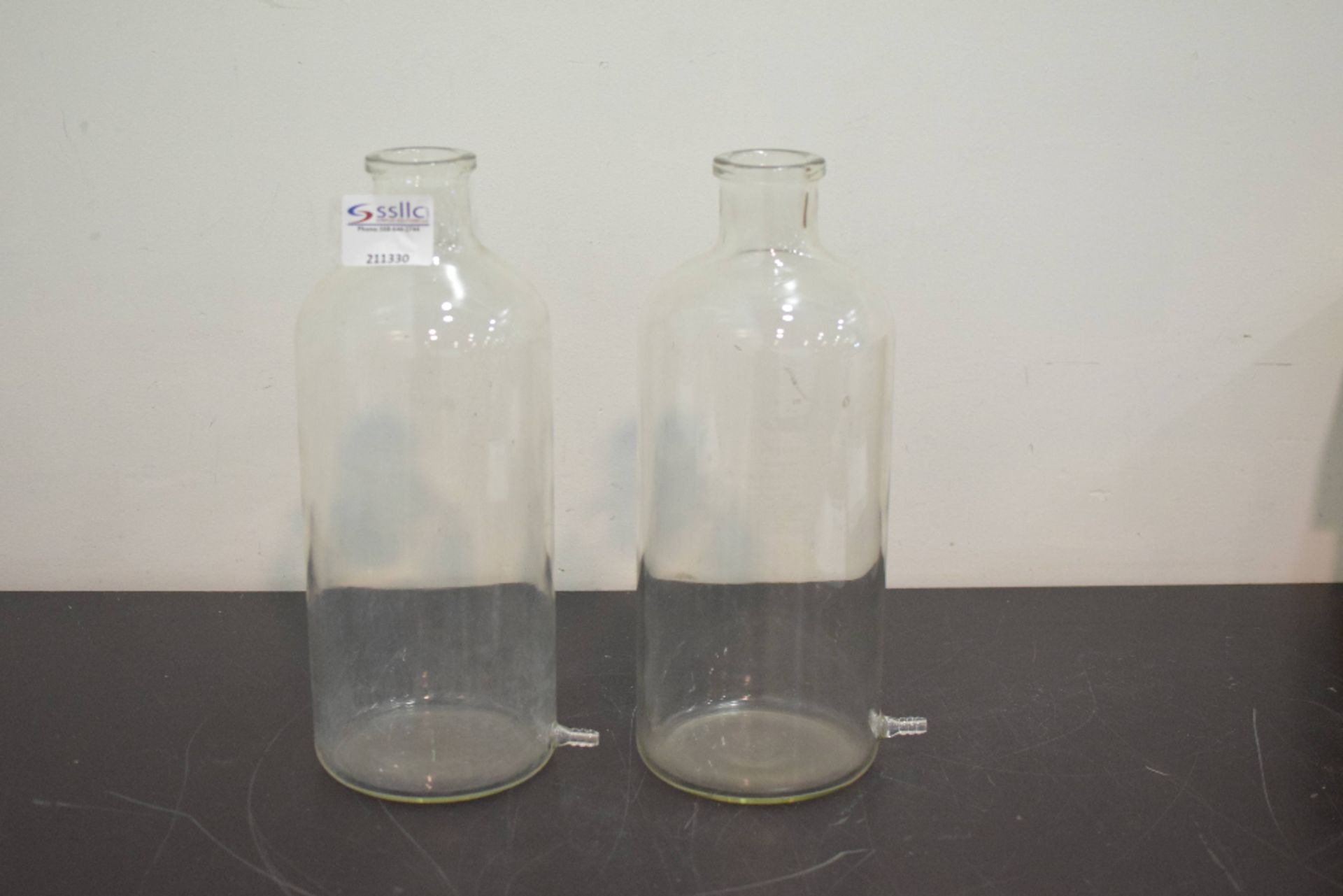 Lot of (2) Glass Bottles with release spout