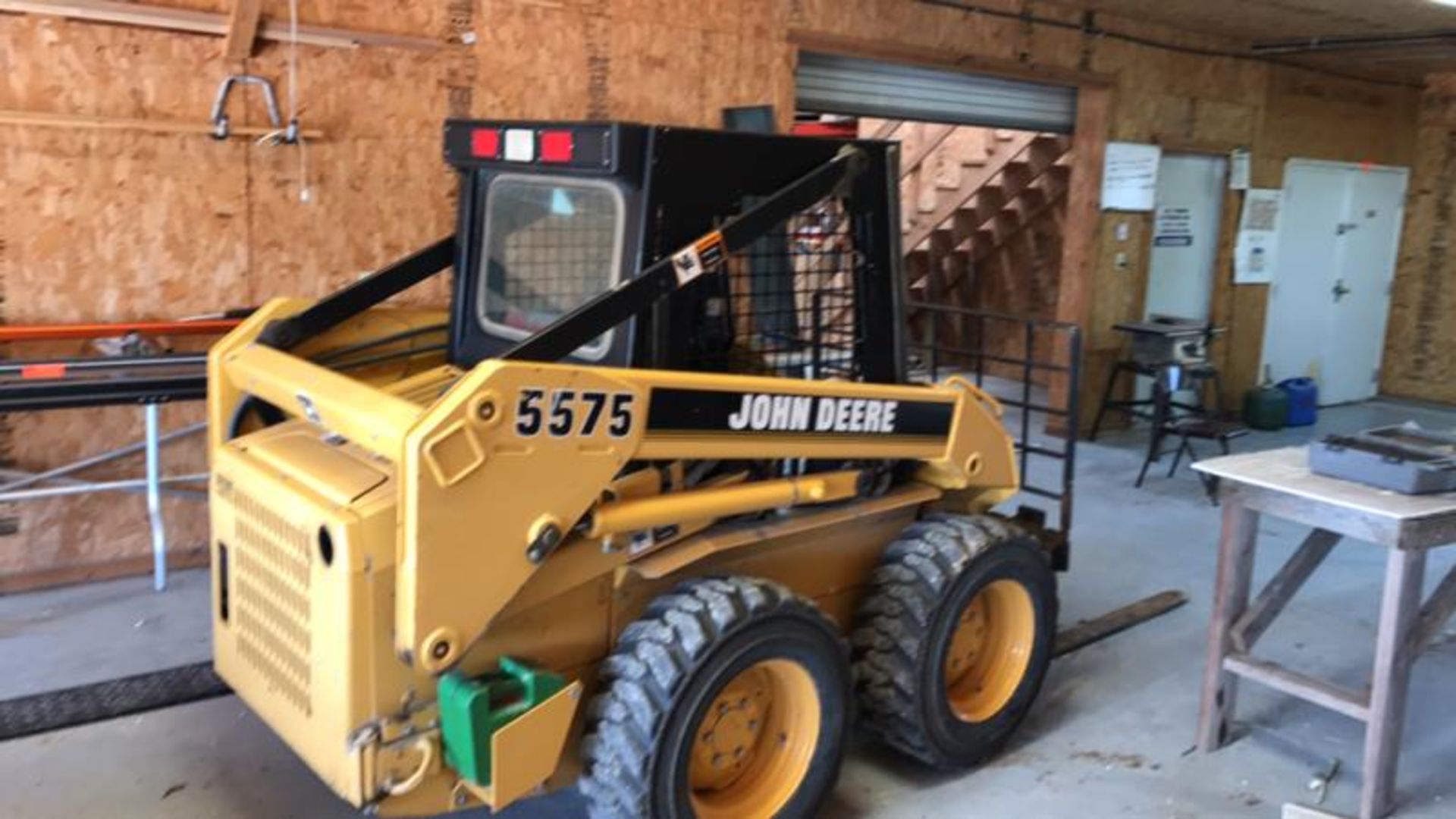 John Deere Skid Steer Loader, Model: 5575, Sn: MG5575X040002, 789.9 hours, w/ forks