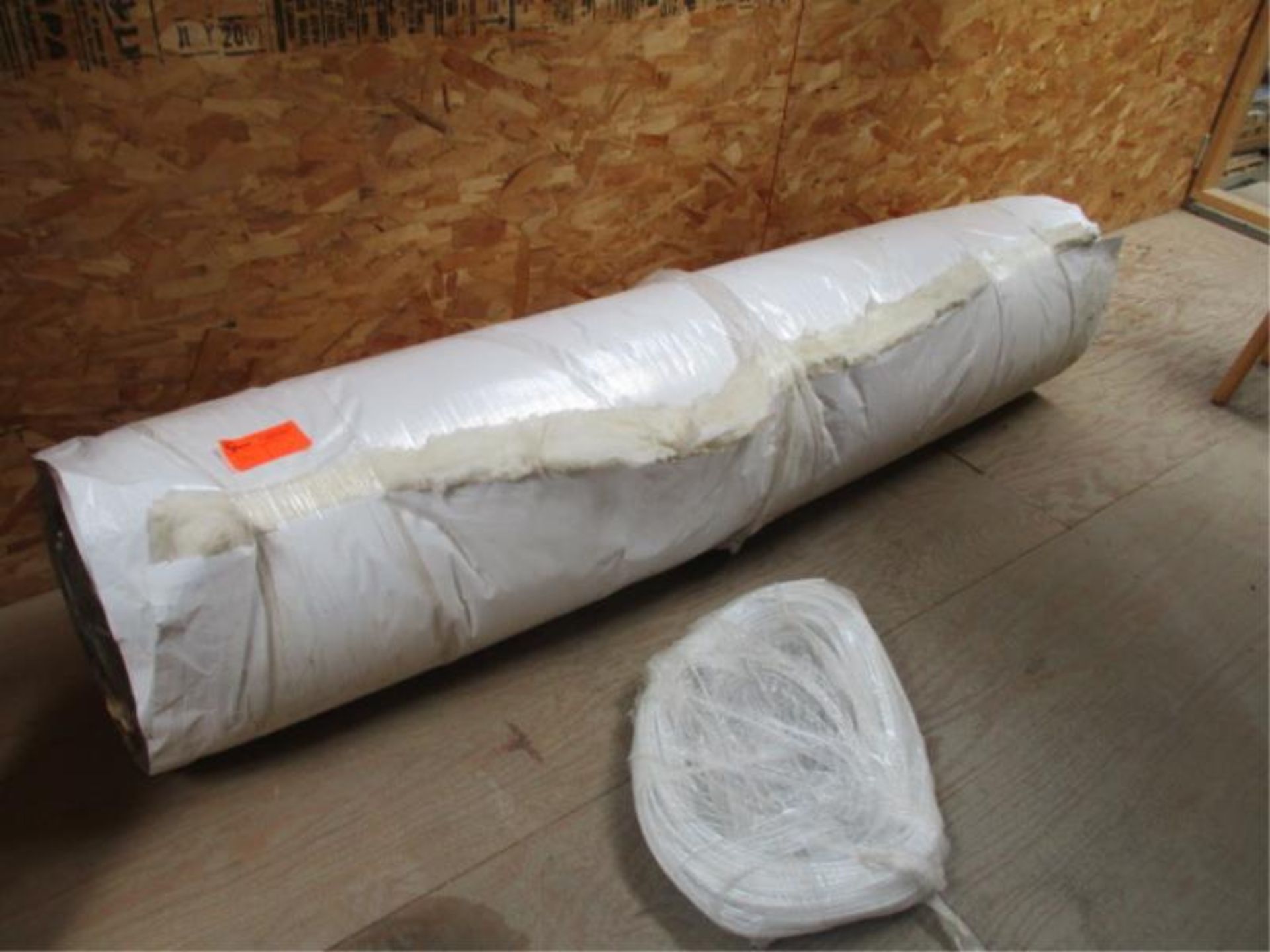 Roll of Metal Building Insulation and Rubber Gaskets'