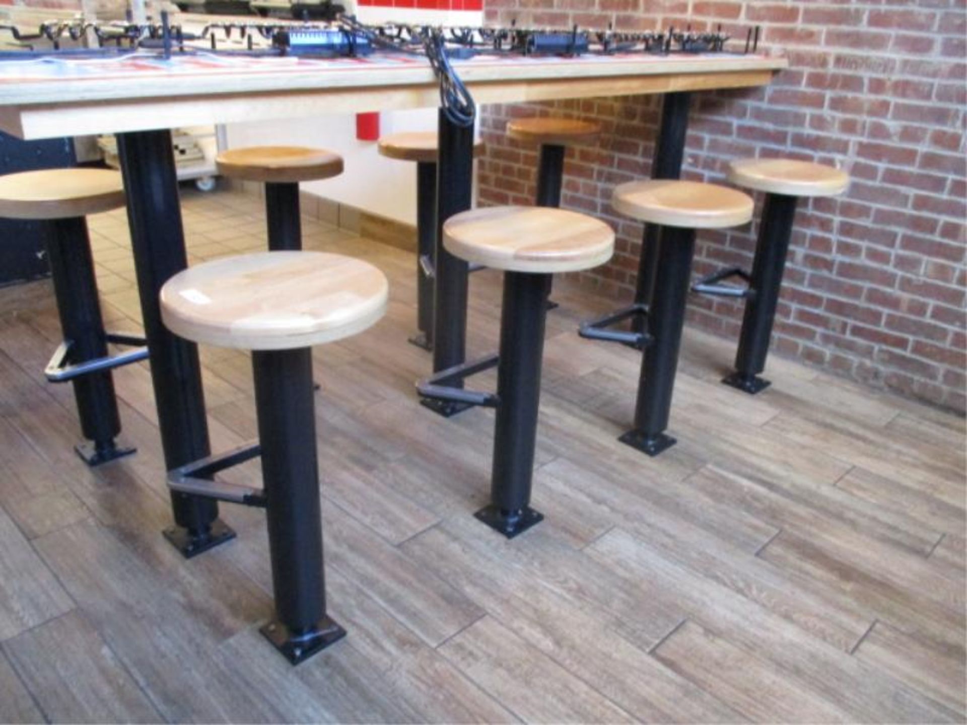 (8) floor mounted stools with wood seal