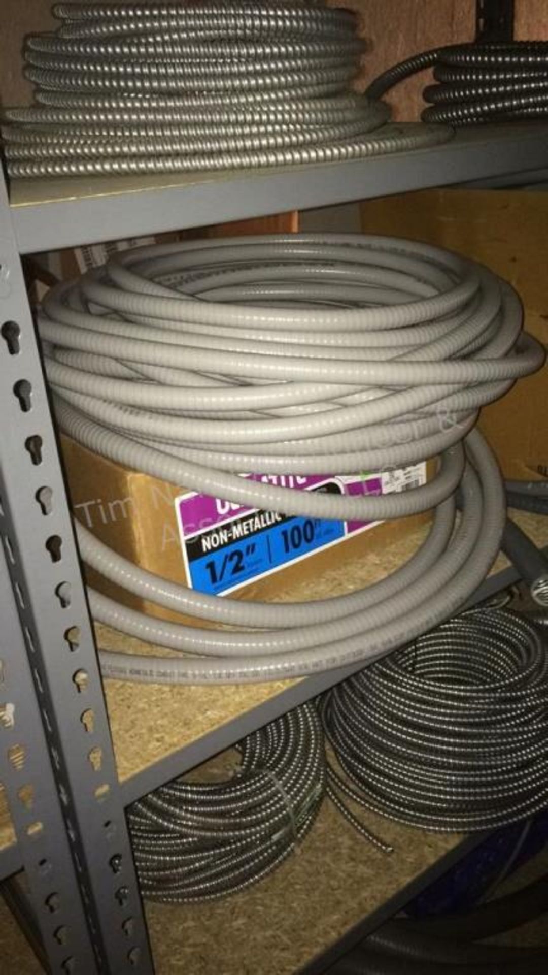 B: contents of shelves – flex conduit & wire