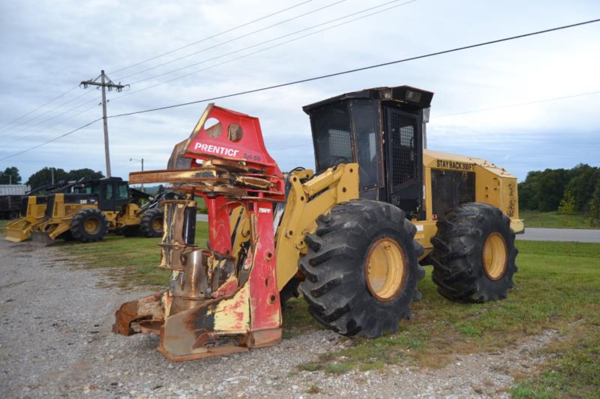 2010 CAT 553 FELLER BUNCHER W/PRENTICE 5H50 SAW HEAD; W/28LX26 RUB; 8004 HOURS SN# HA19802