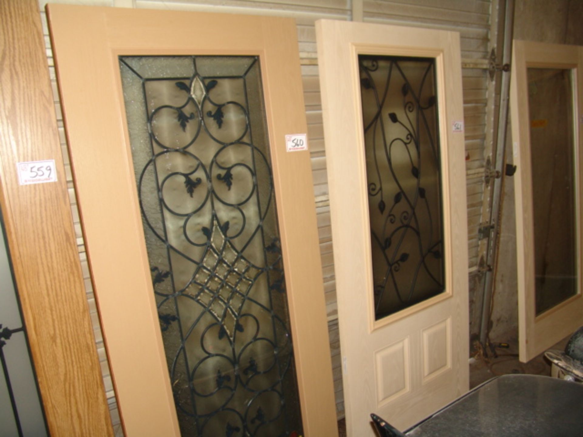 FIBERGLASS OAK FINISH EXTERIOR DOOR, W/ WROUGHT IRON PATTERN IN GLASS