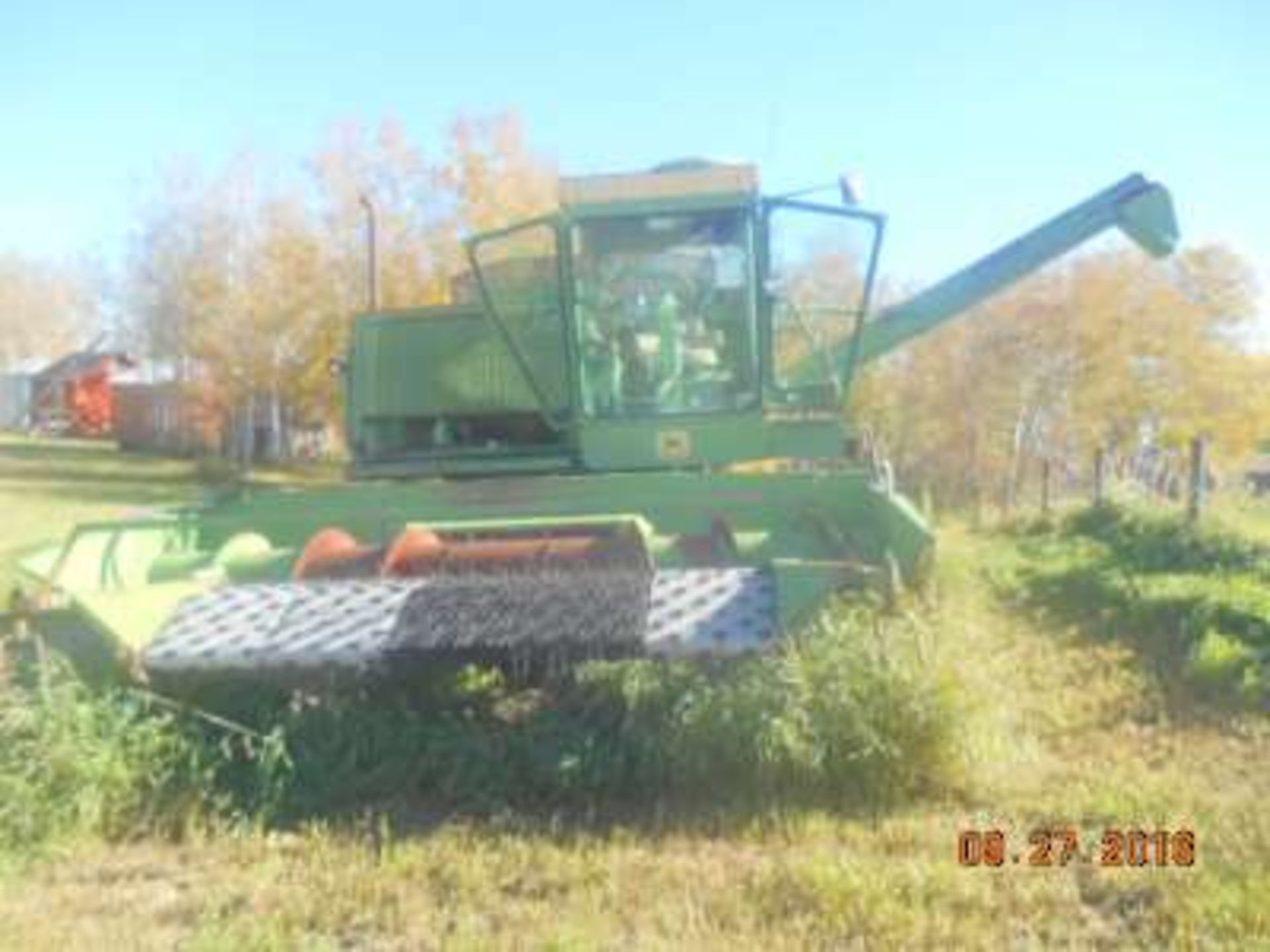 JD 7700 S.P. combine, cab, pickup (running?)