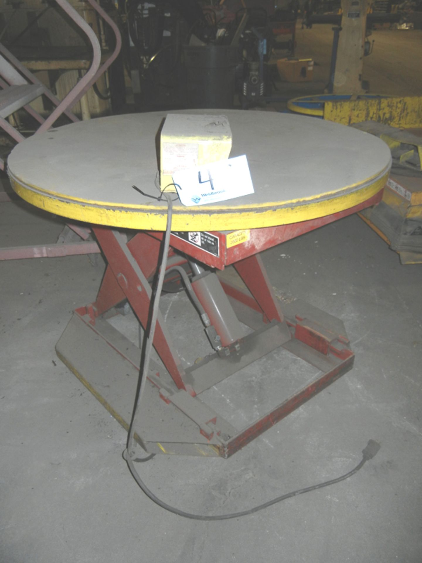 Southworth 2,000 lb capacity Lift Table with 110 volt power, foot pedal controls, 43" diameter