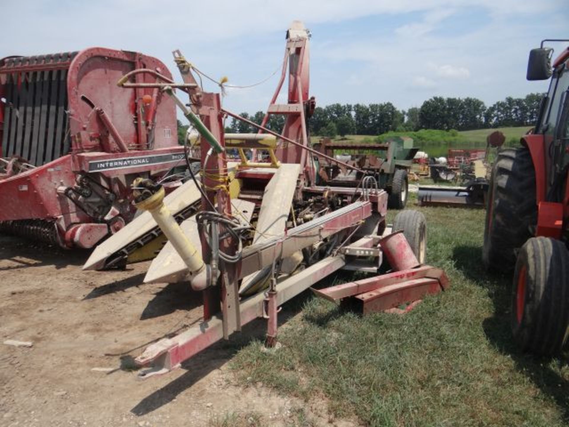 NH 880 Forage Harvester w/2 Row Head, Truck Spout Extensions, Manual in the Shed