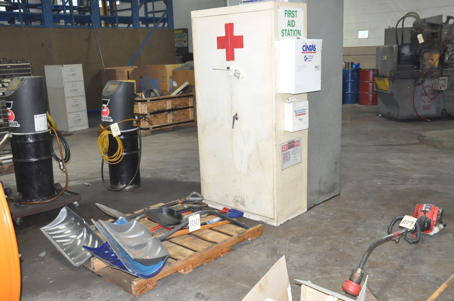 Lot-Shovels and Rakes on (2) Pallets, (1) 2-Door First Aid Cabinet and (1) 2-Door Tall Storage