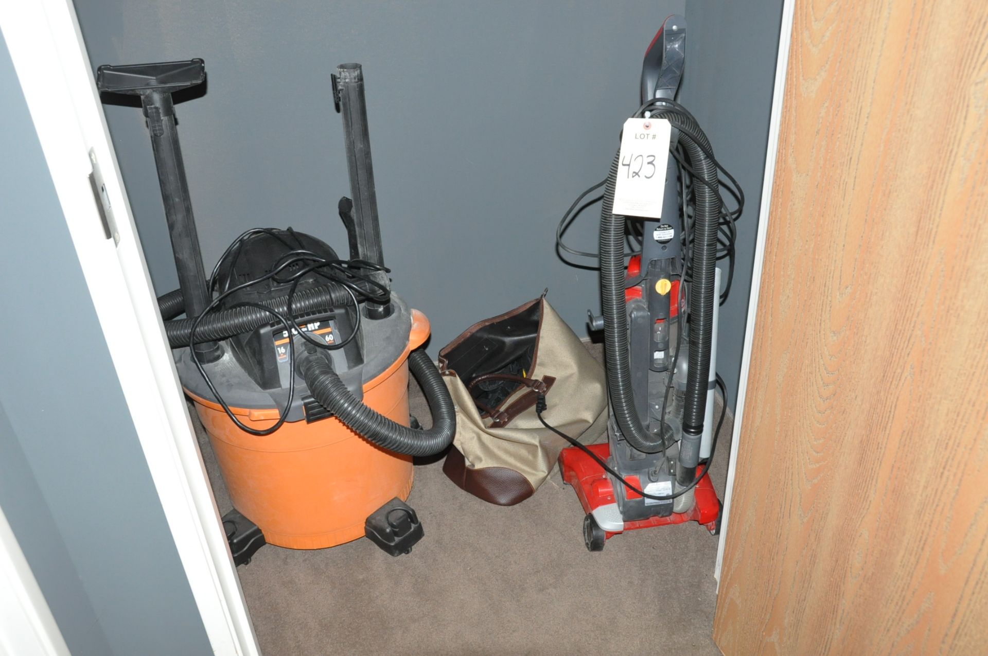 Lot-Shop Vacuum and Upright Vacuum in Office Closet