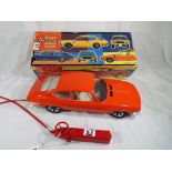 A Fiat Dino 2400 Coupe 1:10 scale remote control car manufactured by A.M.B.