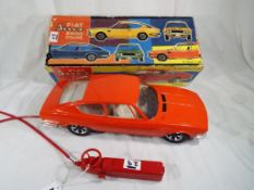 A Fiat Dino 2400 Coupe 1:10 scale remote control car manufactured by A.M.B.