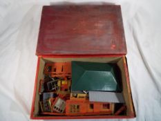 A sliding drawer containing a Playtown model kit and similar