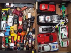 Approximately 50 diecast model motor vehicles contained in two trays to include several 1:18 scale,