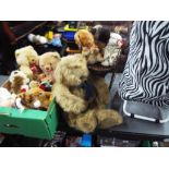 A shopping trolley containing a good collection of Bears and Dolls and a further bear seated in a