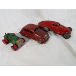 An early period Japanese clockwork airflow / streamlined red car, a Minic clockwork tractor,