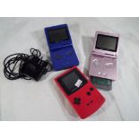 Nintendo - two Nintendo Gameboy Advanced SP hand held games consoles and a Nintendo Gameboy Color