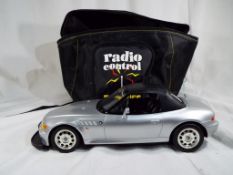 A remote control BMW Roadster by Dickie Speielzeug contained in a Beatties Radio Control Model