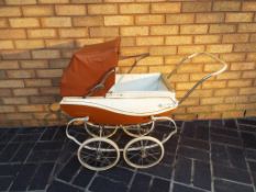 A childs vintage pram (brown and cream)