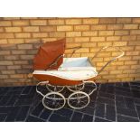 A childs vintage pram (brown and cream)