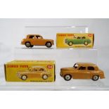 Dinky Toys - # 154 Hillman Minx Saloon, brown body and hubs,