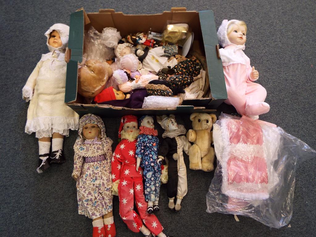 A good lot to include over 10 vintage dolls and dolls clothes and 1 doll marked E W Byron to the