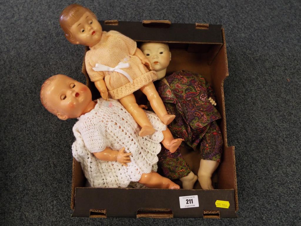 Dolls - a dressed doll with jointed limbs and crying panel to the back marked 14 with sleeping eyes,