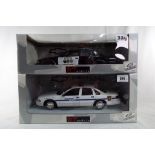 UT Models - two 1:18 scale diecast models, North American police cars, Cheyenne and Brea,