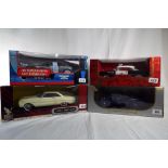 Four 1:18 scale diecast models comprising James Bond 007 Aston Martin V12 Vanquish,