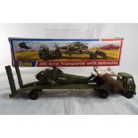 Dinky Toys - # 618 a diecast AEC Articulated military Transporter with Helicopter with net covering