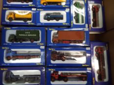 A collection of 27 1:76 scale / OO scale diecast models of commercial motor vehicles by Base Toys,