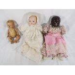 3 vintage dolls. One has papier mache head and stuffed body. A "Reliable" doll, made in Canada.