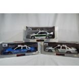 UT Models - two 1:18 scale diecast models, North American police cars, New York and Metro Dade,