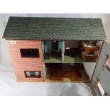 A 1950's wooden, furnished dolls house measuring 50 cm x 64 cm x 27 cm.