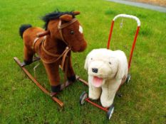 A child's sit-on rocking horse and a push-along dog