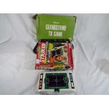 An Adman Grandstand TV game and an electronic striker game in original box by Palitoy